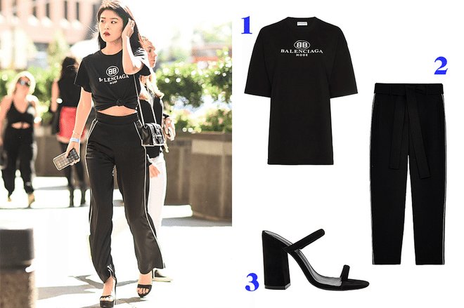 We've all seen the logo T-shirt, from Gucci to Levi's, but make it street-style chic by replacing the typical jeans pairing with silk joggers. To elevate this casual sporty look, go for a platform heel—what, did someone say you can't wear heels with sweatpants? Dressing up a T-shirt has never been easier.

Shop similar pieces: 1.Balenciaga logo t-shirt,$425; 2. Artizia silk pant, $128; 3. Raye platform sandal, $148.
Photo: Getty