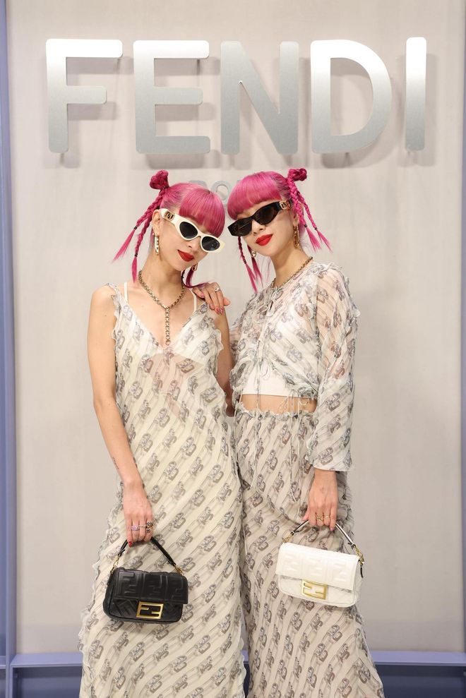 MILAN, ITALY - SEPTEMBER 21:  Ami Suzuki and Aya Suzuki of Amiaya attend the Fendi Spring Summer 2023 Show during Milan Fashion Week  on September 21, 2022 in Milan, Italy. (Photo by Daniele Venturelli/Getty Images for Fendi)