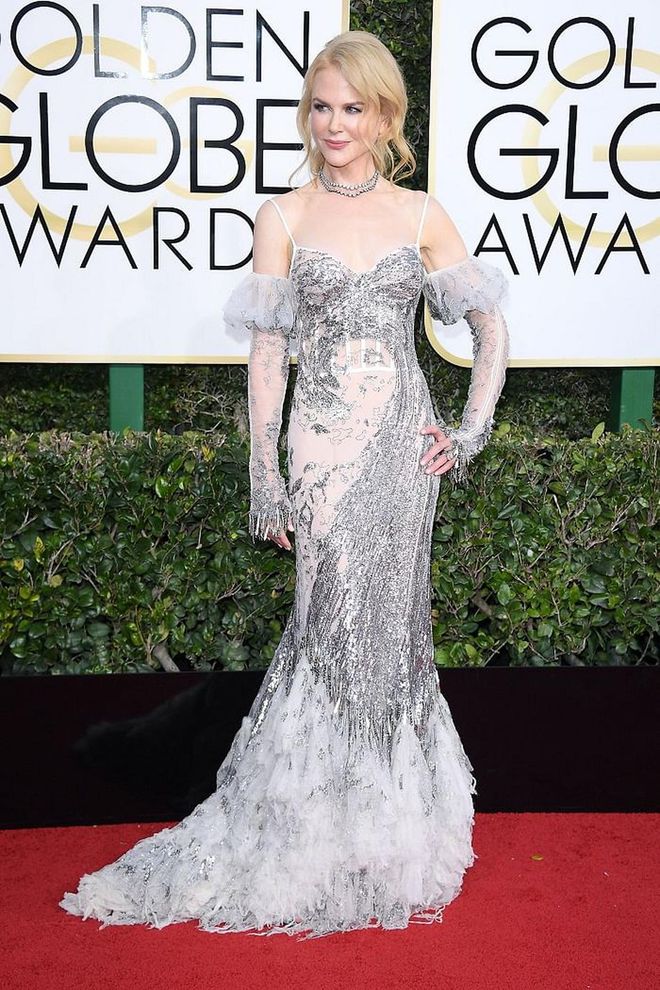 Nicole Kidman proves that all the things that were once ruled too 80's for the aisle - like ruffled mermaid skirts, silver sequins paired with sheer insets and puffed off-shoulder sleeves all work. The actress wowed as she ushered in some much needed maximalism to the Golden Globes red carpet with a runway look from Alexander McQueen's Spring 2017 Collection. 