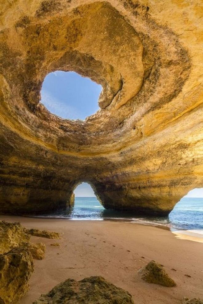 Even though this natural cave is only accessible by water, it's worth the trip. It features a natural occurring oculus on top of a secluded beach and is a mesmerizing sight to see when the sun illuminates it from above. Photo: Getty