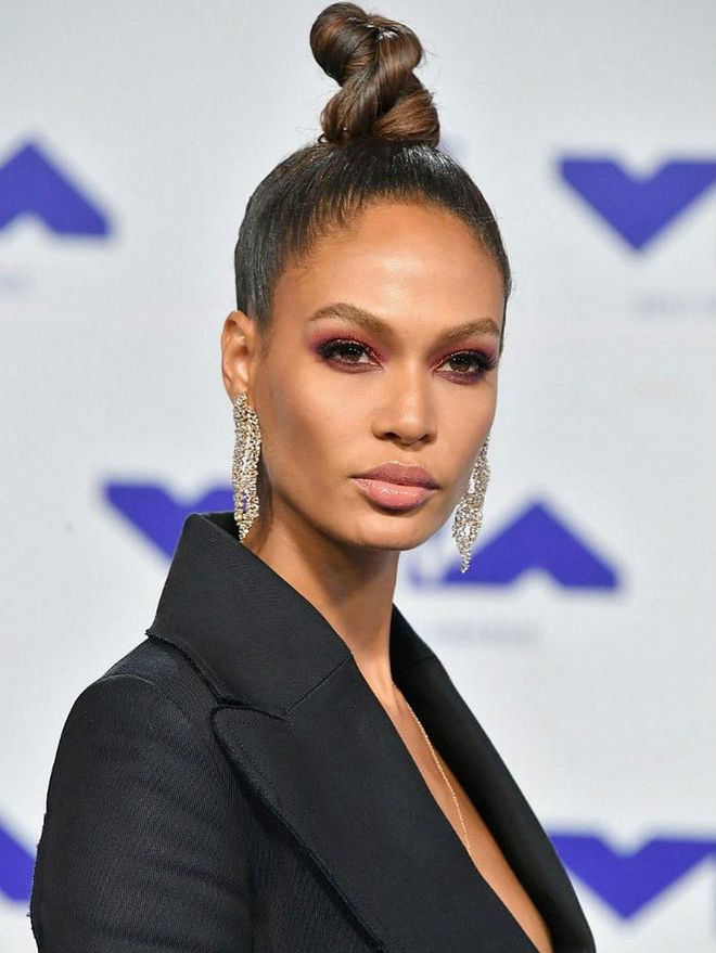 Joan Smalls took a top knot to new heights with this sleek, twisted version.