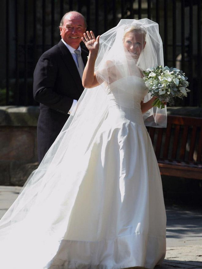 When Queen Elizabeth's granddaughter, Zara Phillips, married Mike Tindall on July 30, 2011, her father, Captain Mark Phillips, escorted her down the aisle.

Photo: Getty