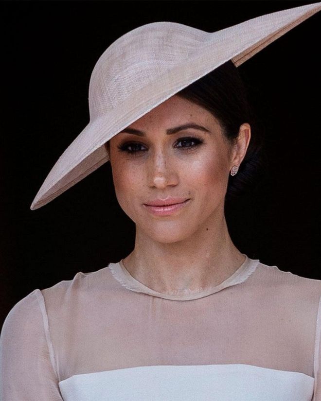 While we loved Meghan Markle's wedding makeup, we loved the look she wore for her first official outing even more. Strong brows, smoky black eyeliner, champagne highlighter, and peach blush and gloss combine to create a striking but still soft makeup look.
Photo: Getty