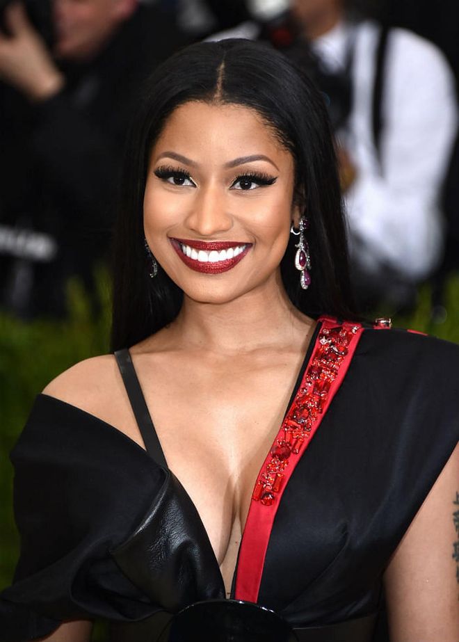 Minaj's lush lashes and metallic red lips was bold, sexy, and extravagant all at the same time (Photo: Getty)