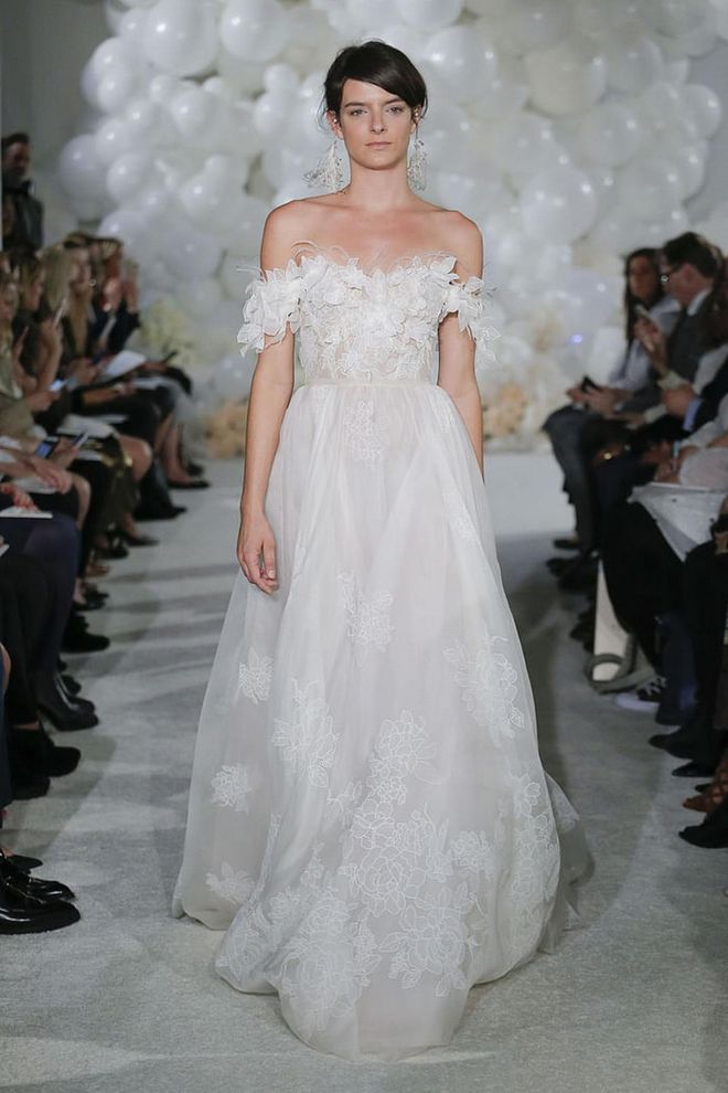 Rather than a strict off-the-shoulder that limits movement , try shoulder swags- they feel as easy as your surroundings, tap into the hot trend you're looking to employ, and they'll allow you to effortlessly dance, embrace your groom and guests, and toss your bouquet. Mira Zwillinger gown, mirazwillinger.com. 