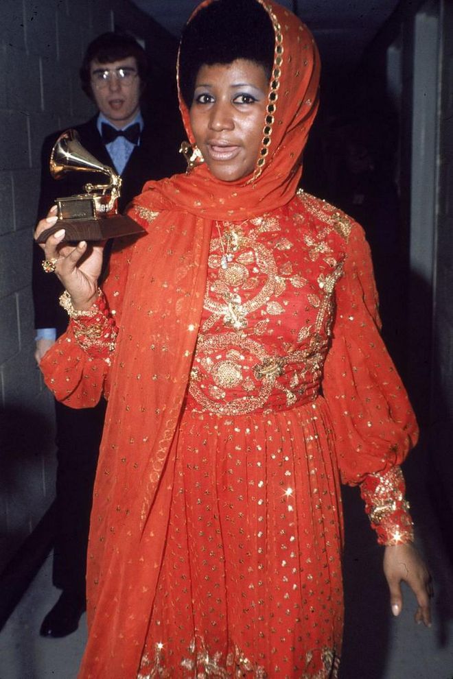 Aretha Franklin took home her Grammy in 1972 wearing a stunning red and gold gown with a matching headscarf.