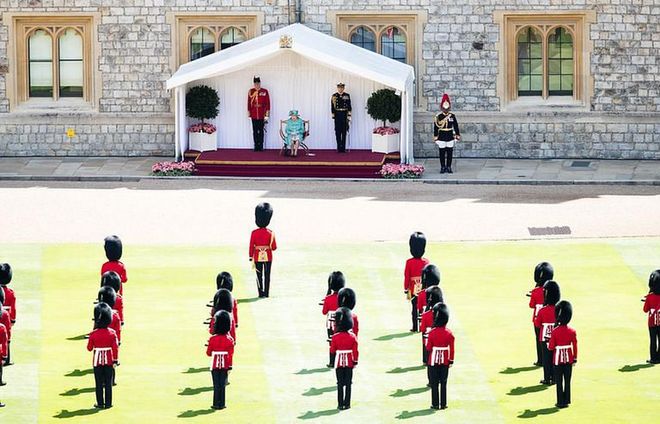 Queen Elizabeth sat on a podium to watch the military drills, and The Welsh Guards remained socially distanced from one another.