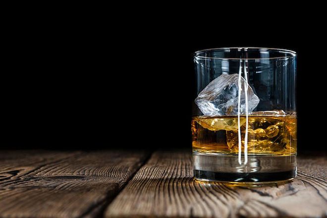 A glass of whiskey on the rocks. (Photo: 123rf)