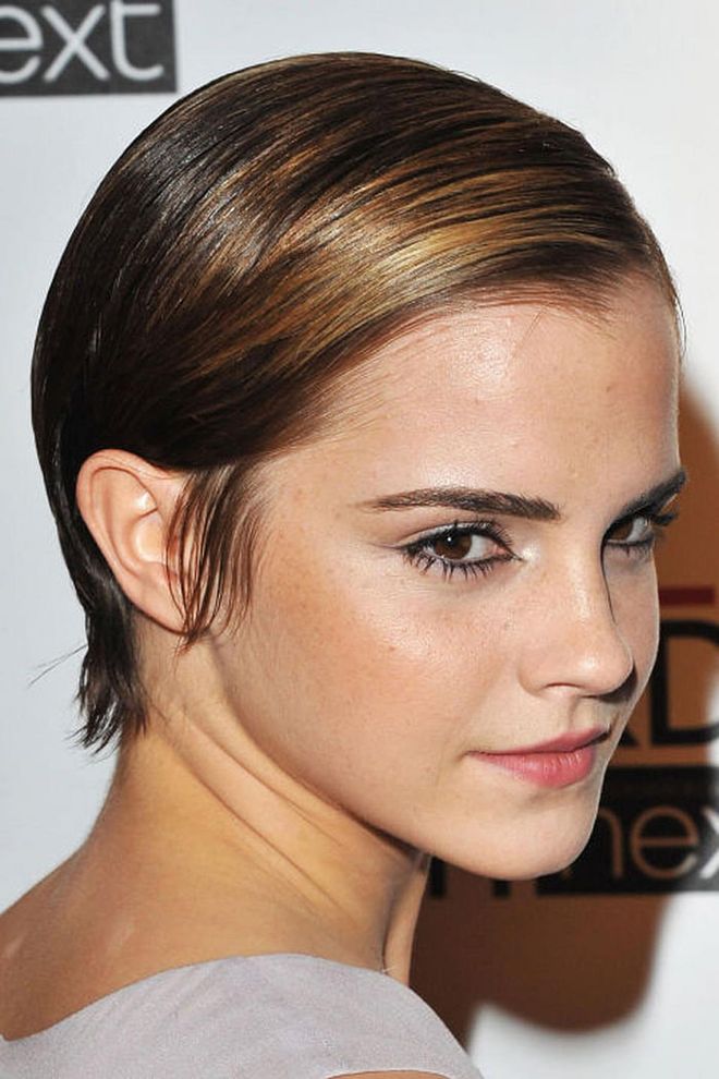 Watson proves just how versatile short hair can be with this slicked-back and shiny style.