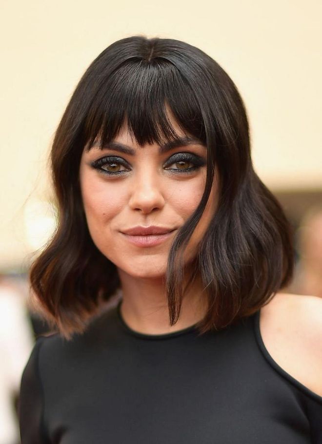 Brow-dusting bangs keep the proportions of Mila Kunis's lob feeling effortlessly cool.

Photo: Getty