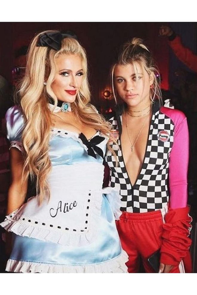 The pair posed as Alice in Wonderland and a race car driver.