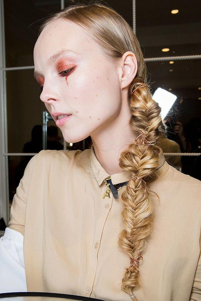 The fishtailed braid with bits of copper strung throughout was stunning (and unexpected) at Christian Sirianos fall show.