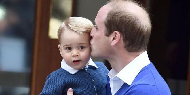 William places a kiss on George before the two head in to meet his new baby sister, Princess Charlotte.

Photo: Getty