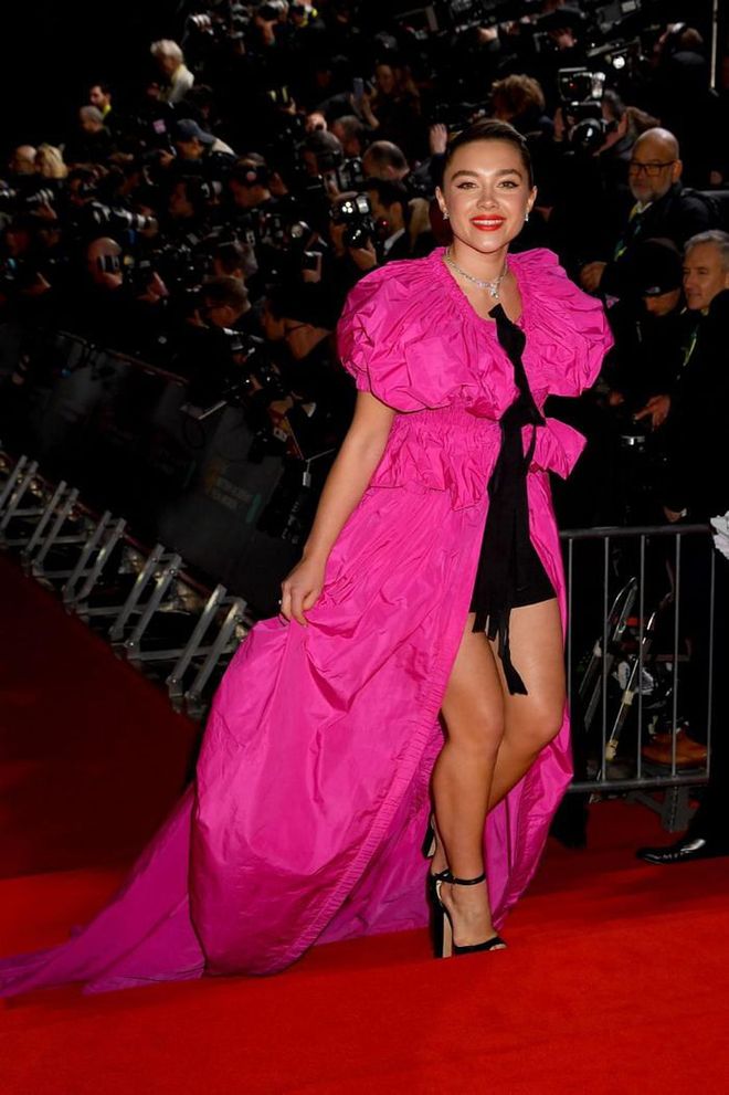 Florence Pugh arrived on the red carpet in a statement pink gown with a long trail.

Photo: Dave J. Hogan / Getty