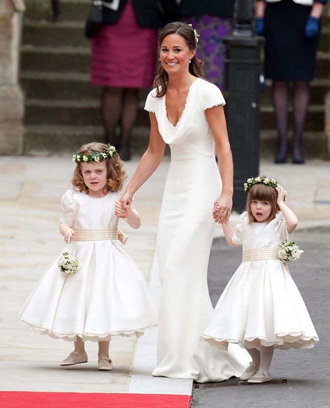 When Kate Middleton married Prince William and went from being a commoner to the Duchess of Cambridge, Pippa Middleton tended to her sister as a bridesmaid, helping with Kate's nearly 9-foot-long satin train. Pippa's dress, designed by Sarah Burton of Alexander McQueen, ended up nearly upstaging Kate because of the way it fit so snugly over Pippa's figure, specifically her bottom.