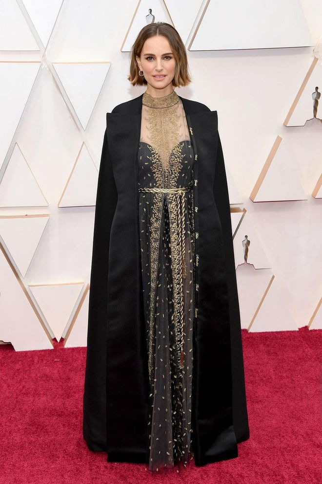 What: Dior Haute Couture and Cartier jewels

Why: Portman is lovely and timeless in a black gown with sheer gold overlay and gilded rope belt. The true standout is a black floor-length cape that is embroidered with the names of all the female directors who were not nominated tonight. We love a fashion and a feminist statement all in one. Photo: Getty