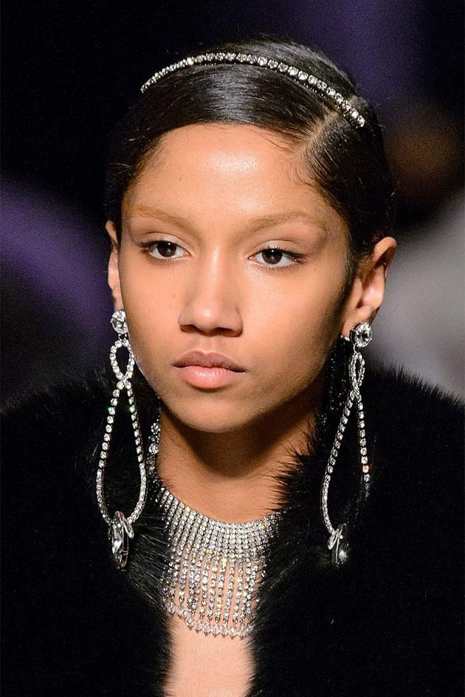 Miu Miu is never one to shy away from unabashed femininity, as evidenced by the jeweled headbands and matching teardrop earrings. 
