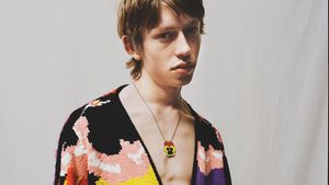 A look from the fall/winter 2021 menswear collection featuring a motif of pansies inspired by the works of Joe Brainard (Photo: LOEWE)