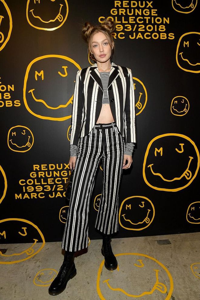 Gigi served us 90s realness with this pinstripe suit from Marc Jacob's Grunge Collection, coupled with space buns to boot! 