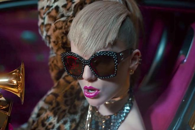Or, wait, no—maybe it's wild, party-girl Taylor? With glittery fuchsia lipstick and thick, combed-over bangs? Or, let's be real, it's probably a nod to Katy Perry, what with the front-seat leopard, the leopard-print dress, and, you know, the hair. 