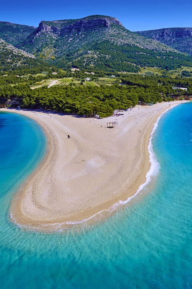Located on the southern coast of Brac Island, Zlatni Rat Beach is nicknamed the Golden Horn for its unusual shape that juts out into the Adriatic Sea.