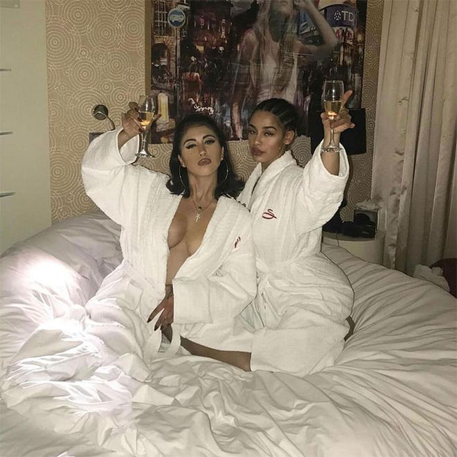 This duo of rising singers posed in matching robes and raised a glass to women around the world.