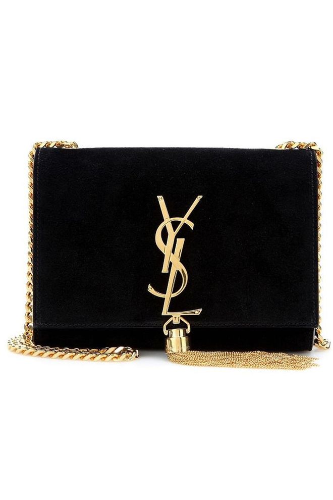 Saint Laurent's elegant tassle bags are the perfect addition to any evening ensemble. Suede monogram bag with tassle, £1,150