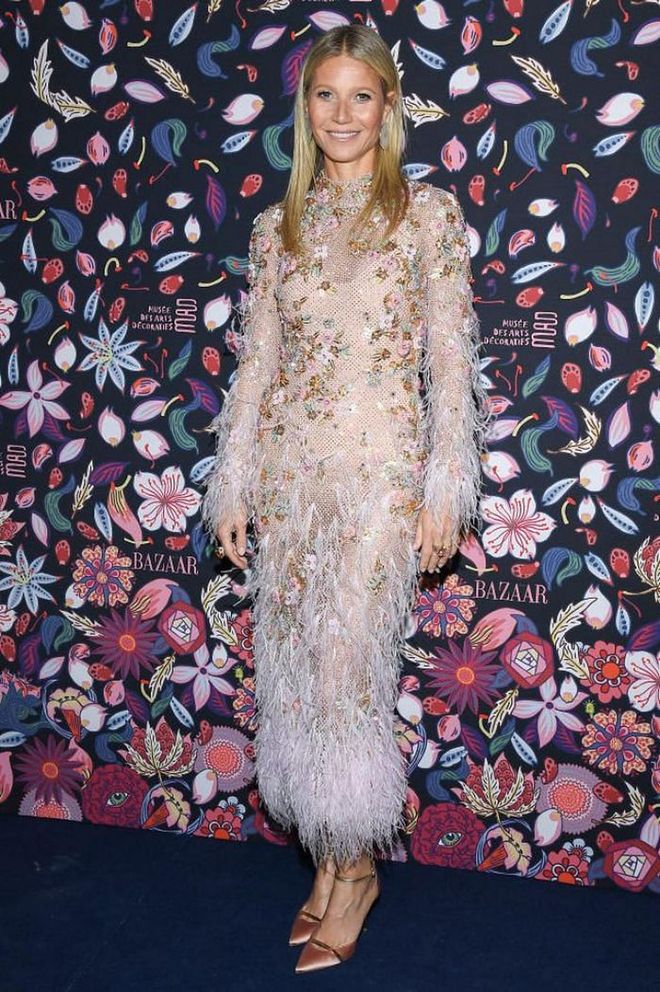 Gwyneth Paltrow attended the Harper's Bazaar Exhibition in a feathered ensemble.

Photo: Pascal Le Segretain / Getty