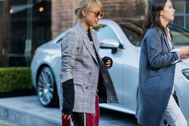 Margaret Zhang wearing a grey blazer, red leather pants. Photo: Getty 