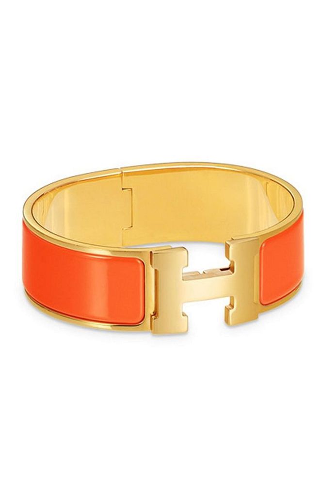 Add a pop of colour to your jewellery with this vibrant orange Hermès cuff.