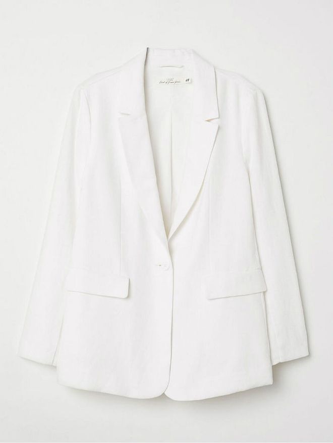 Here’s another way you can style a blazer: Swap out the usual tailored shirt and wear a sexy bralette or satin spaghetti top underneath to amp up the sexy vibes. Wear this classic white piece with some mustard pants for a pop of colour.

