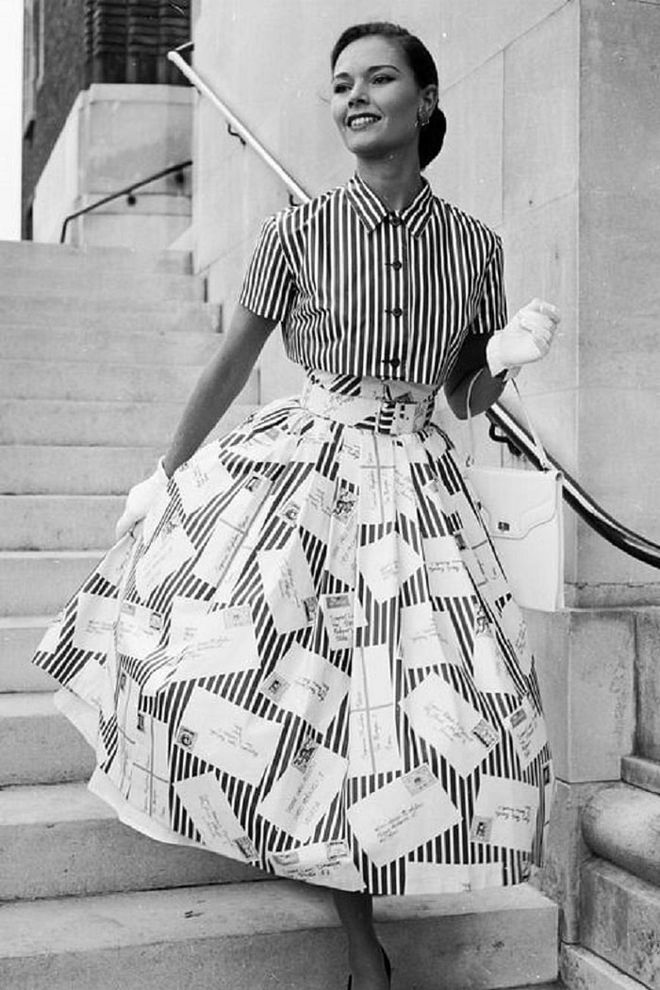 A woman in a striped button-down and full circle skirt.

Photo: Getty