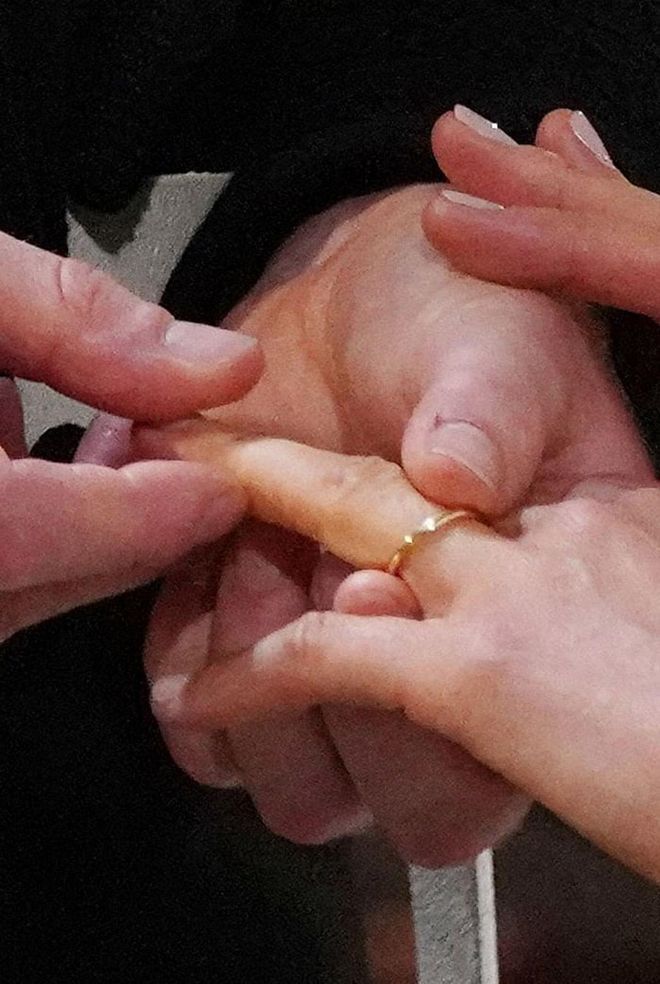 Meghan honored generations of royal brides before her by wearing a wedding ring made of extremely rare Welsh gold. The Queen Mother started the trend back in 1923, and Queen Elizabeth, Princess Margaret, Princess Anne, Diana, Princess of Wales, and the Duchess of Cambridge all received bands of the same metal. Photo: Getty