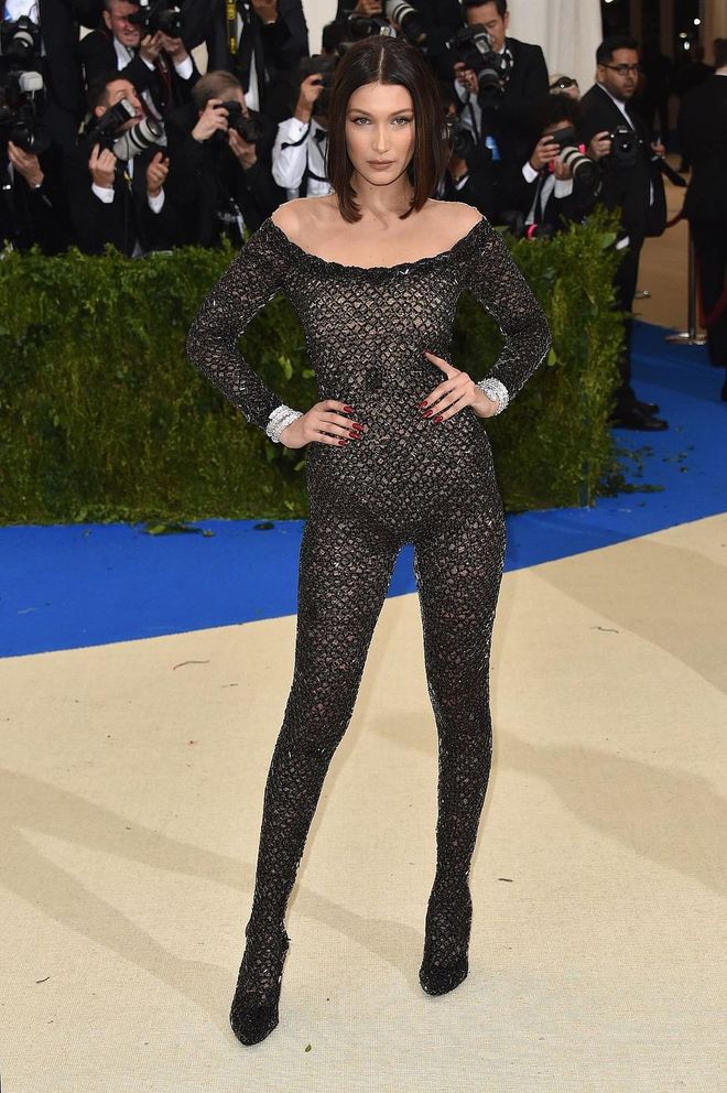The queen of sheers herself, Bella Hadid is not about to be outdone on the red carpet. She did not disappoint, wearing an entirely sheer fishnet body suit that goes right down to the heels. If that wasn't enough, the body suit is also backless, featuring a graphic cut-out at the back. Hubba hubba! Photo: Getty 