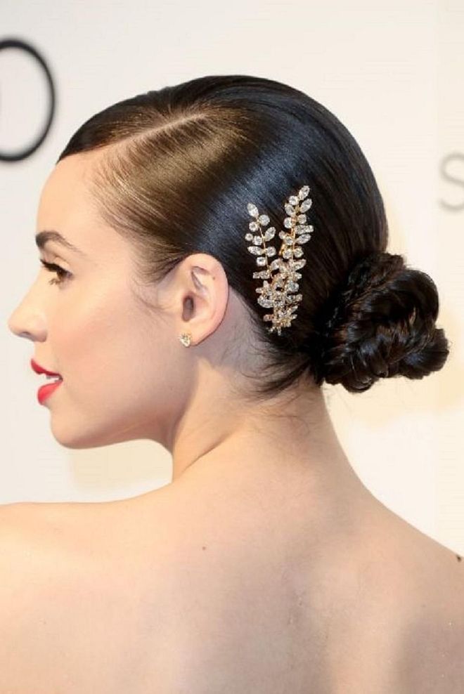 Adding a "hair accessory" doesn't have to mean walking down the aisle in a tiara. When placed just behind the ear, the piece dresses up an otherwise ordinary look. Photo: Getty 