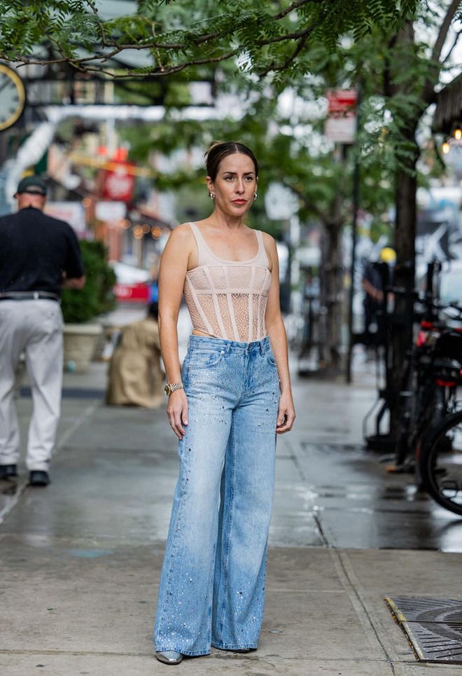 NEW YORK, NEW YORK - SEPTEMBER 11: Idalia Salsamendi wearing Dion Lee top and Paris Texas boots, denim jeans on September 11, 2022 in New York City. (Photo by Christian Vierig/Getty Images)