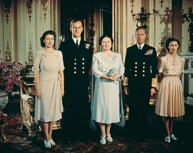 A young Queen Elizabeth II, Philip Mountbatten, Queen Elizabeth the Queen Mother, King George VI and Princess Margaret pose in July 1947 in the royal apartments to celebrate Elizabeth and Philip's engagement. Philip reportedly proposed with a three-carat diamond ring that consisted of a center stone flanked by 10 smaller diamonds.
