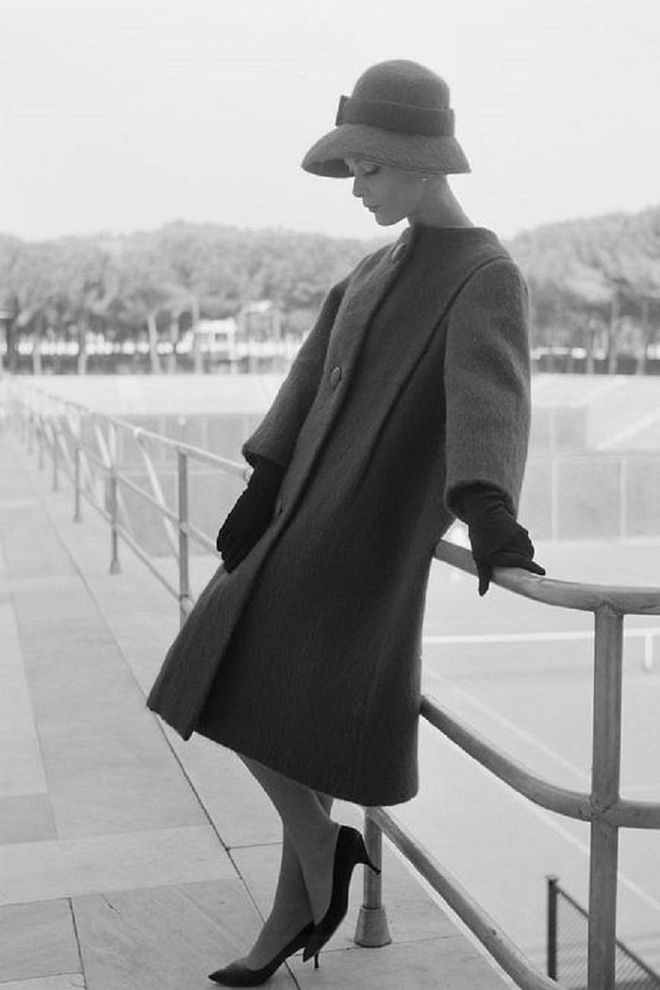 A woman modeling a winter coat and matching hat in Rome.

Photo: Getty