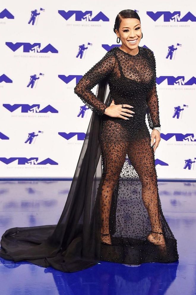 In a black bodysuit with a mesh overlay. Photo: Getty