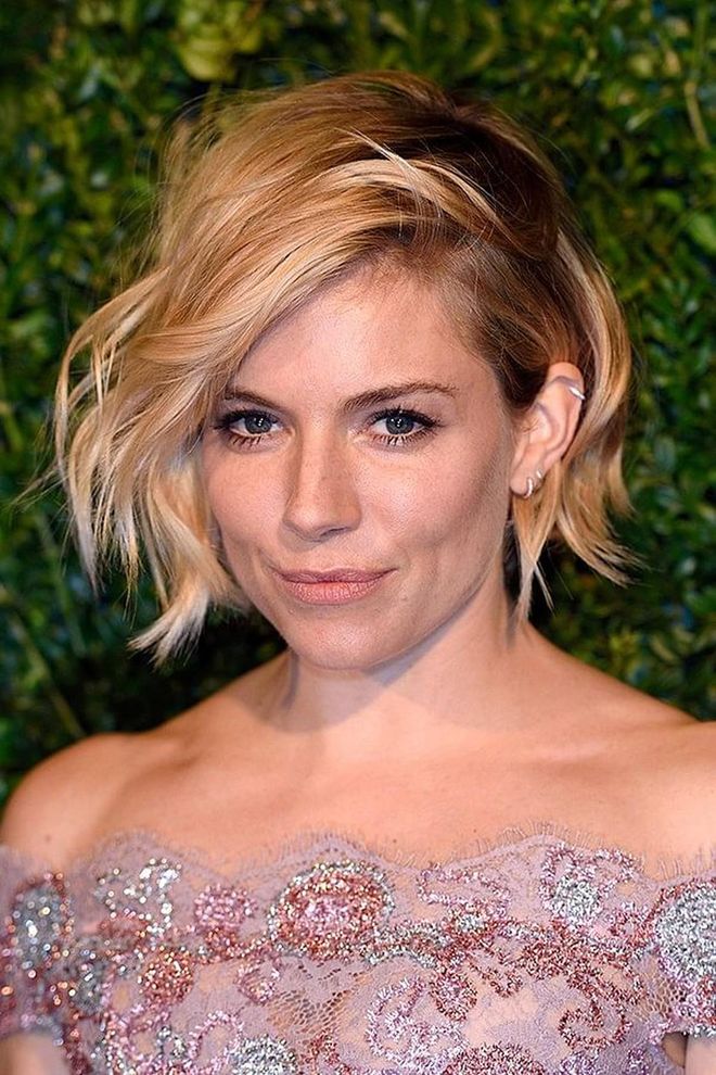 A tousled texture and deep-side part like Sienna Miller’s is the way to style a bob this season – we love this look on a chin-length crop.