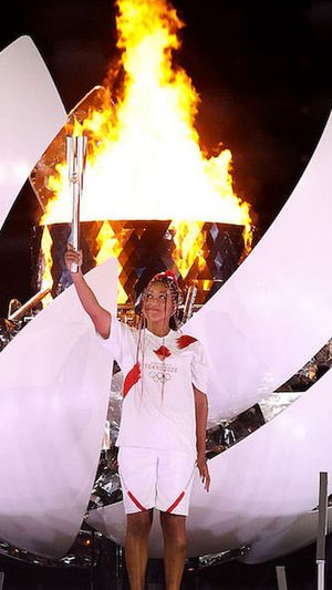 Naomi Osaka of Team Japan lights the Olympic cauldron with the Olympic torch during the Opening Ceremony of the Tokyo 2020 Olympic Games at Olympic Stadium on July 23, 2021 in Tokyo, Japan. (Photo: Jamie Squire/Getty Images)