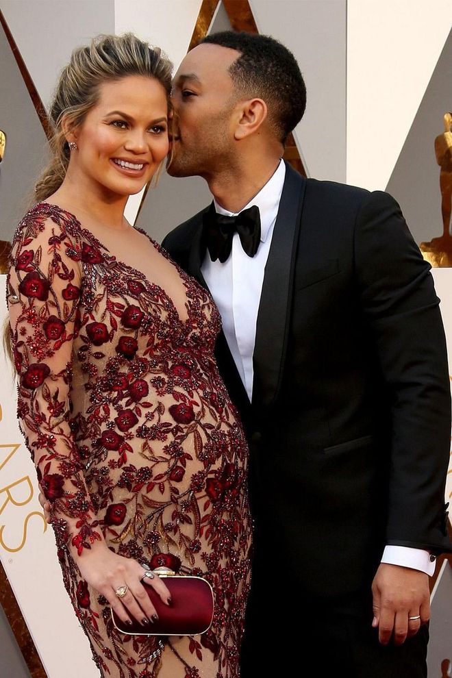 Ultimate love birds Chrissy Teigen and John Legend have reigned King and Queen of the Red Carpet since tying the knot in 2013. In 2016, Legend shared a quick kiss with then-pregnant Teigen before heading into the 88th Annual Academy Awards. Photo: Getty