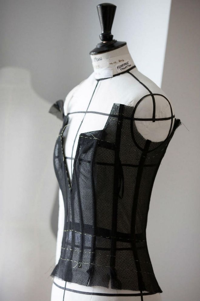 The bodice of the dress begins to be constructed with black material. Photo: Dior