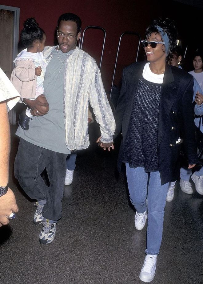 Bobby Brown, Whitney Houston, and Bobby Christina arrive at LAX, 1995. Photo: Getty 