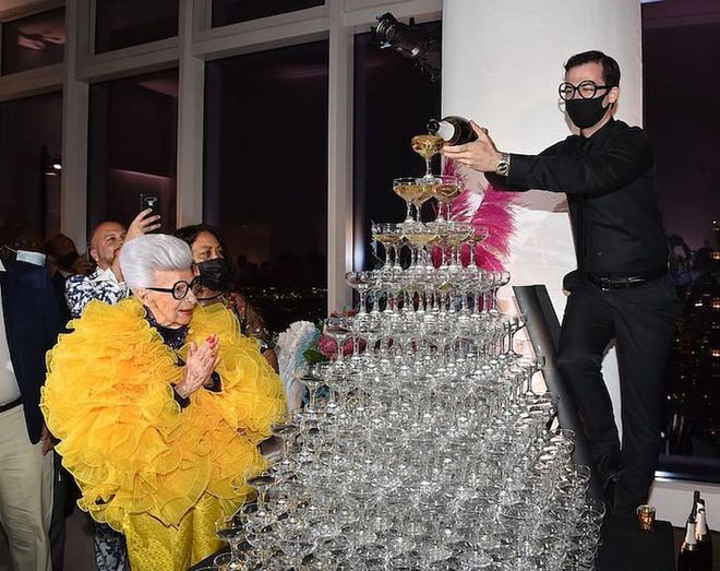Iris Apfel with a champagne tower (Photo: Getty Images)