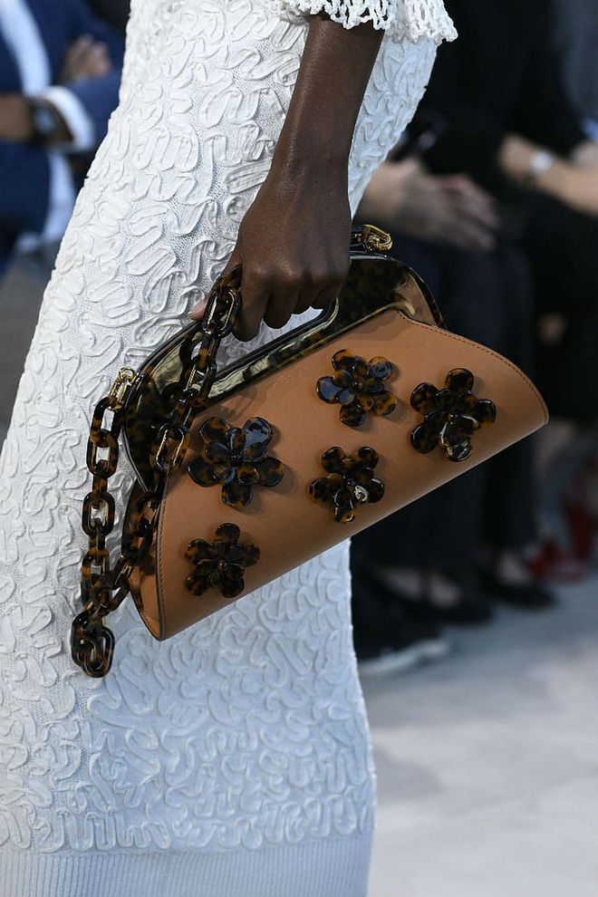 Seen at: New York Fashion Week//Why we love it: The black floral motifs embellished on the sepia-toned bag brings about a heartwarming sense of nostalgia. (Photo: Getty)