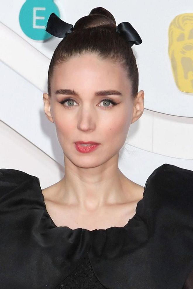 The queen of hair accessories, Rooney Mara's black satin bow was a chic addition to her sleek twisted up-do.

Photo: Getty