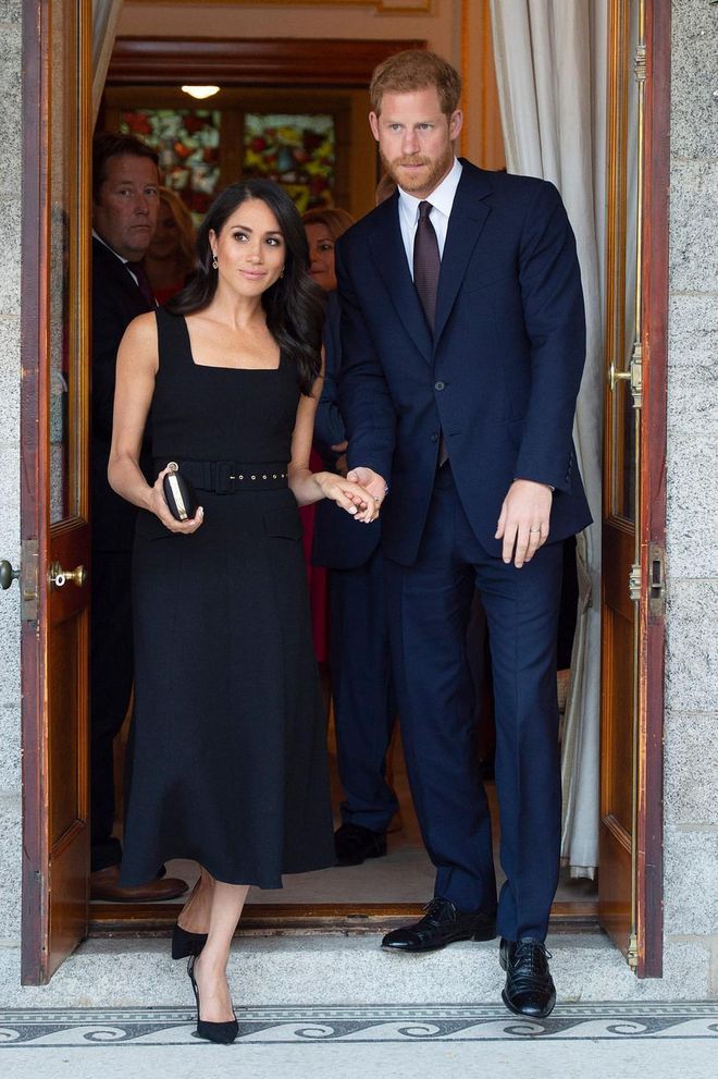 The duo arrives to a garden party at the British Ambassador's residence at Glenciarn House in Dublin. Markle wears a black dress sleeveless dress by Emilia Wickstead for the occasion.

Photo: Getty