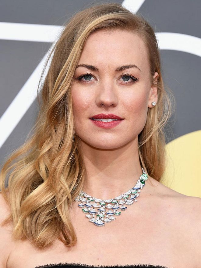 Wearing a stunning Bulgari necklace with hints of green and blue, paired with simple diamond studs. Photo: Getty 