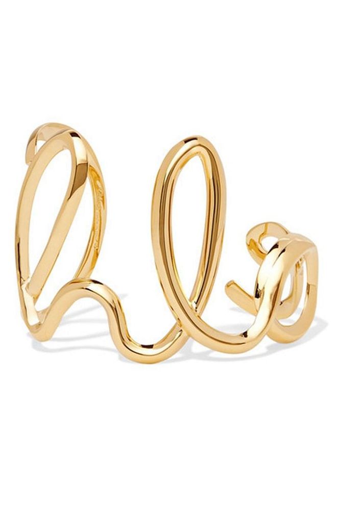Spelling out the brand's name, this fun bangle is best worn solo, either by day or night.